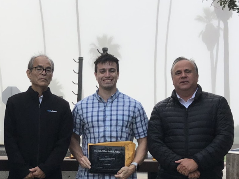 Jordan Smith holding award between Shuji and DenBaars