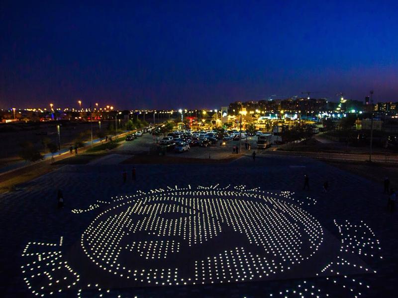 LED lights on the ground at night creating a face of a man